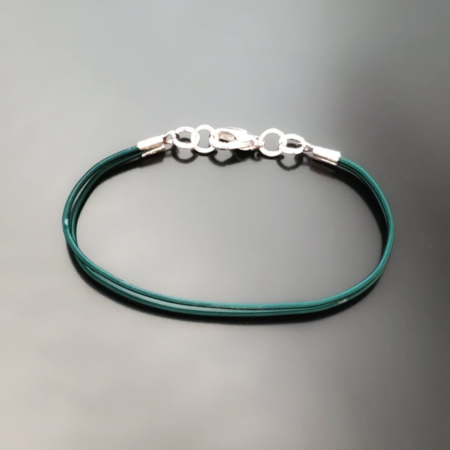 Green Harp String Clasp Style Bracelet