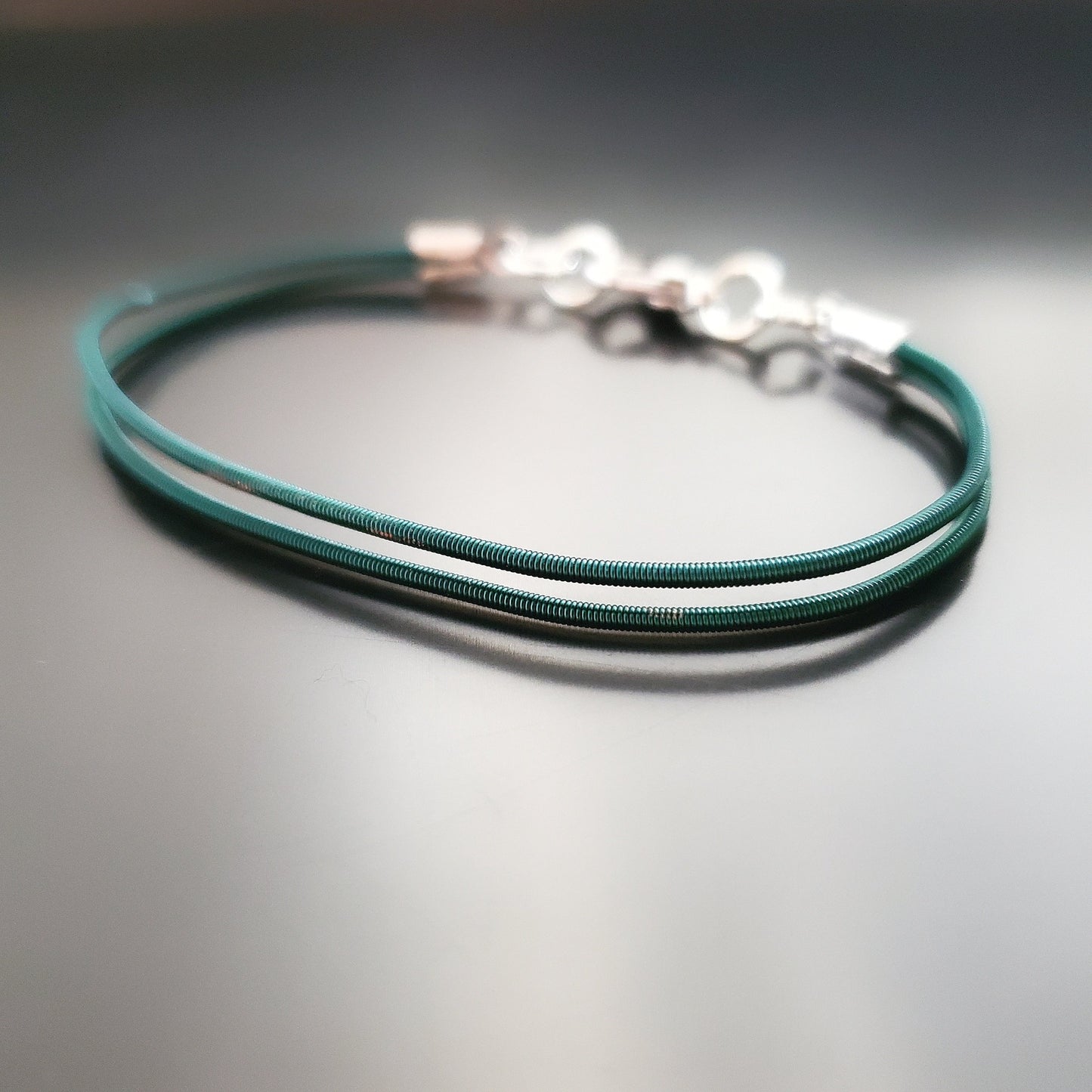 Green Harp String Clasp Style Bracelet
