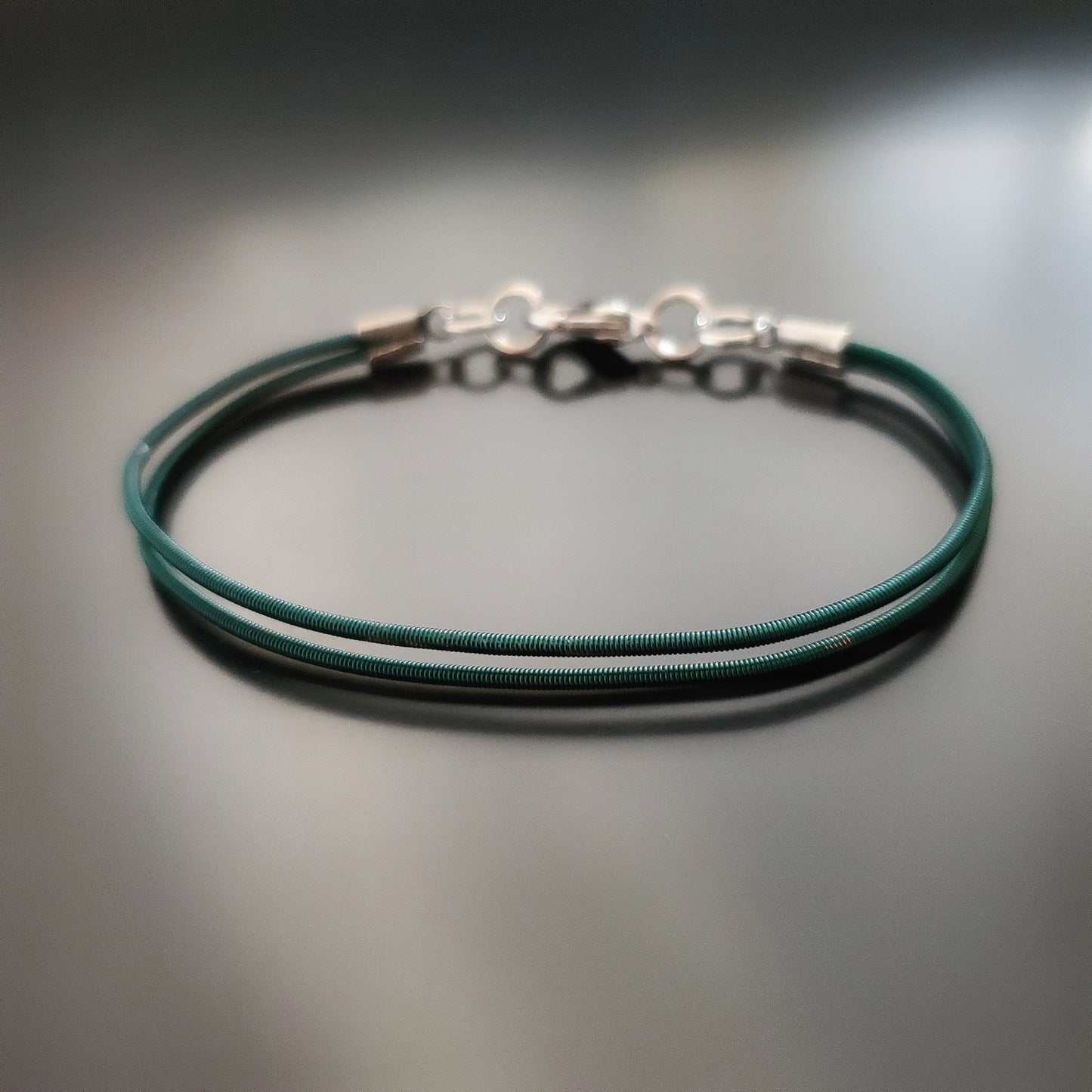 Green Harp String Clasp Style Bracelet