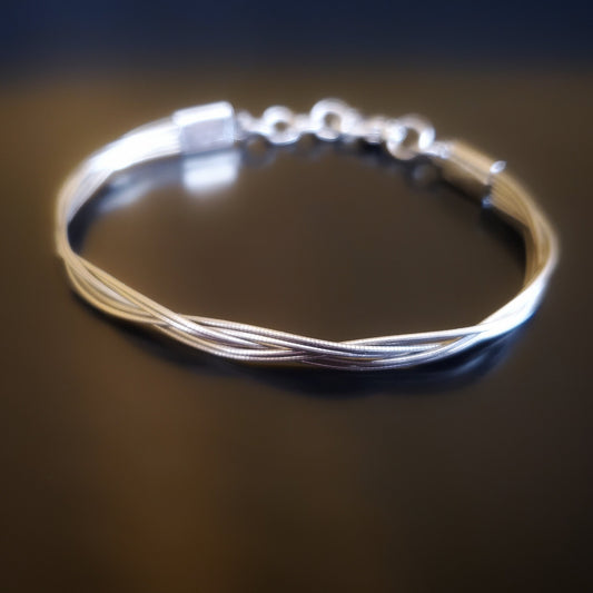 upcycled cello string unisex silver bracelet black background