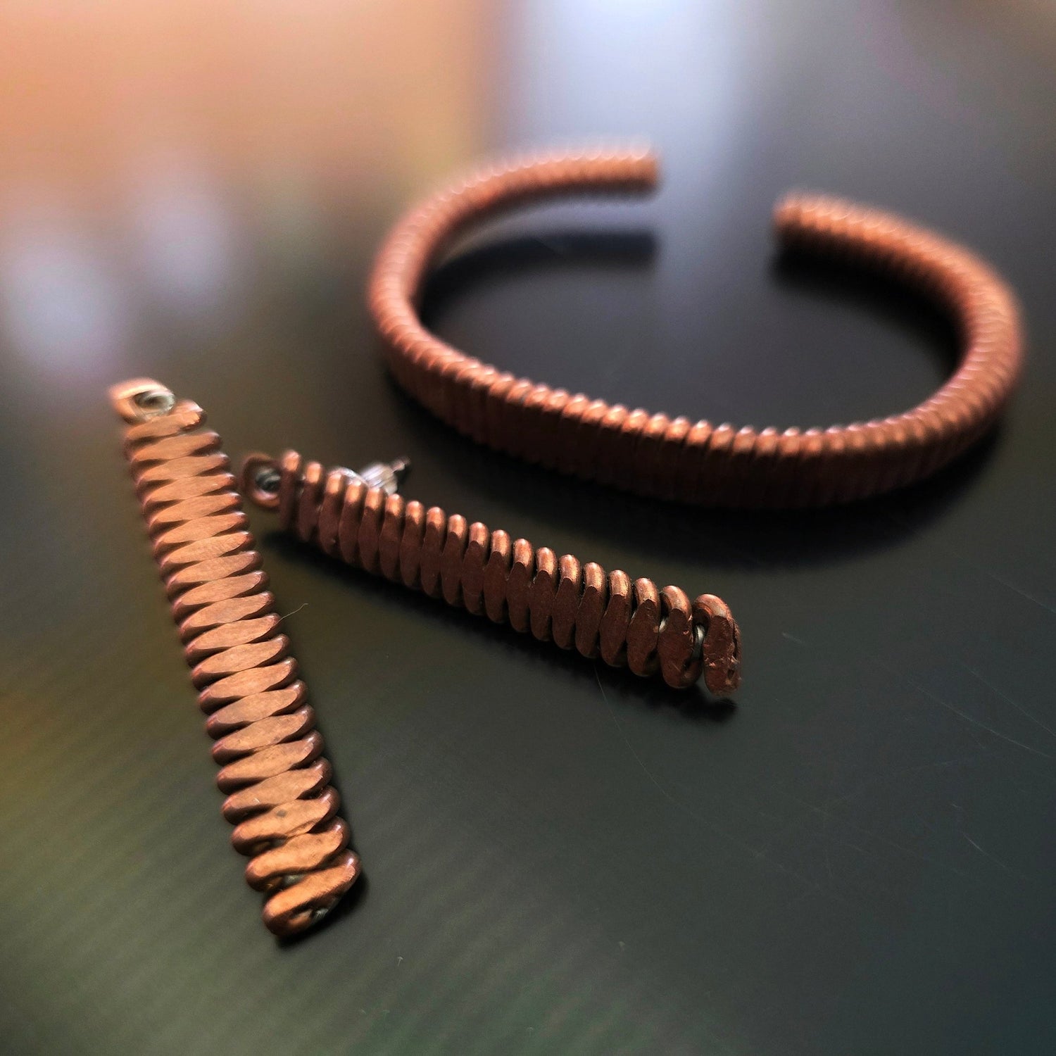 Upcycled Piano String Bracelets and Earrings Set on black background