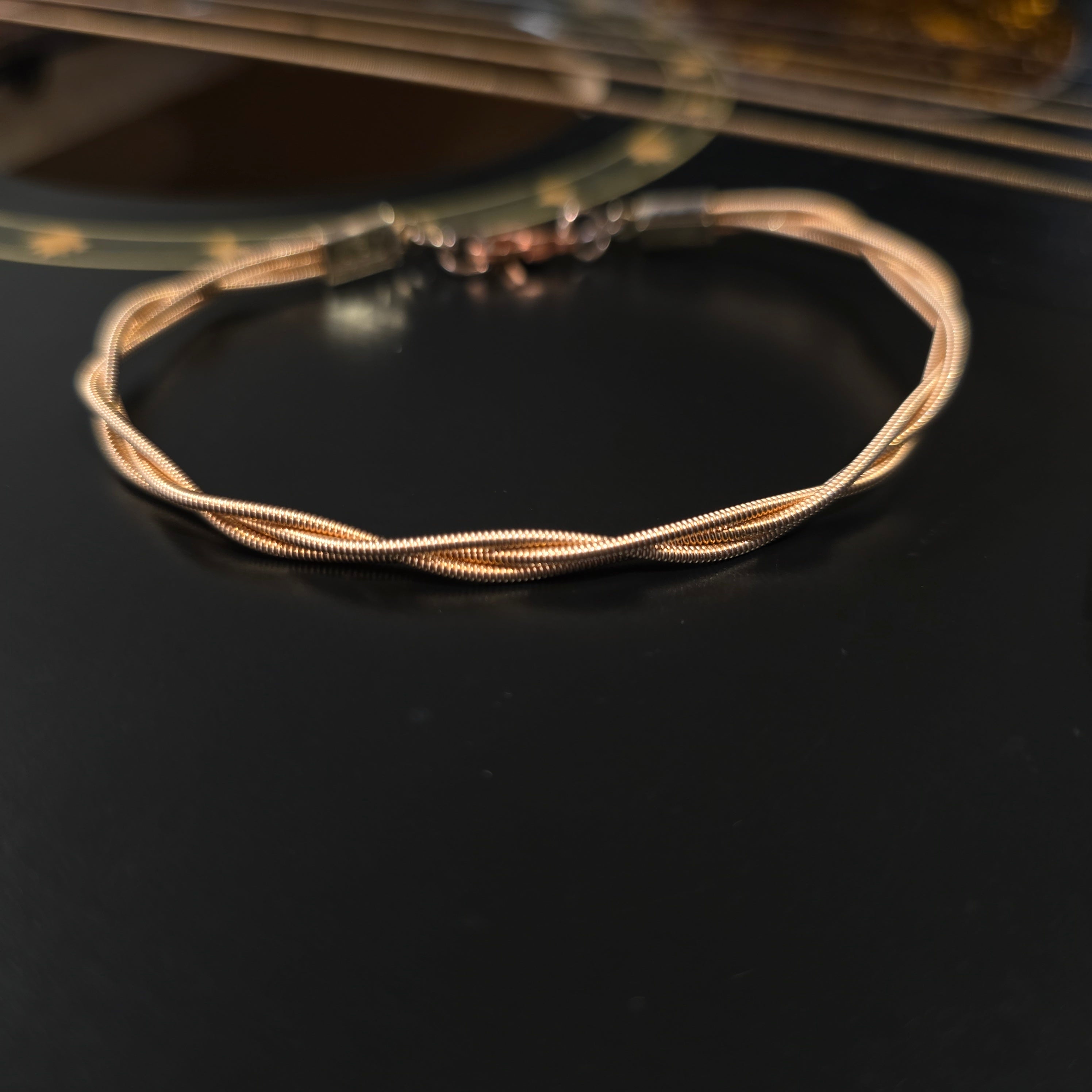 Bracelet unisexe en cordes de guitare tressées