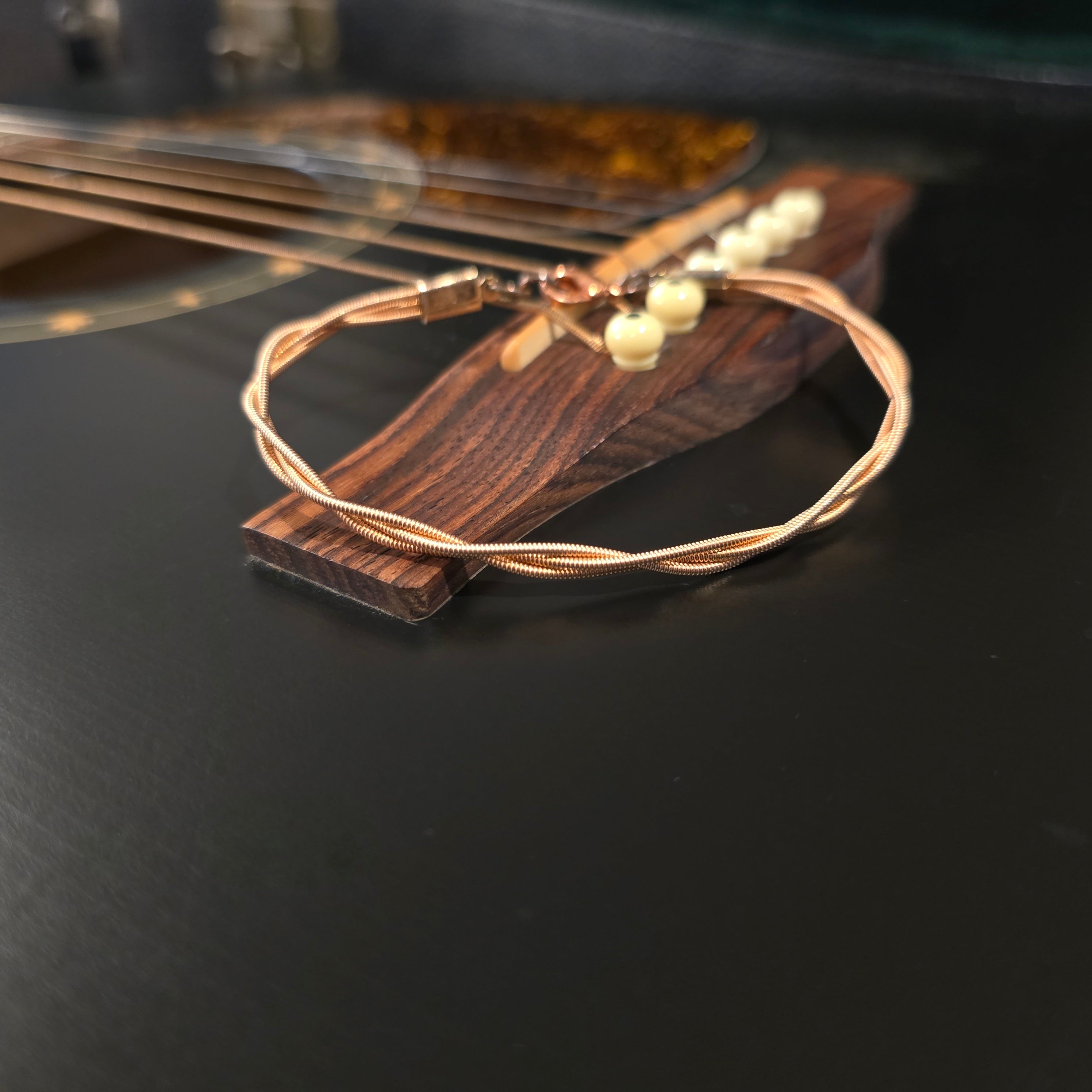 Bracelet unisexe en cordes de guitare tressées