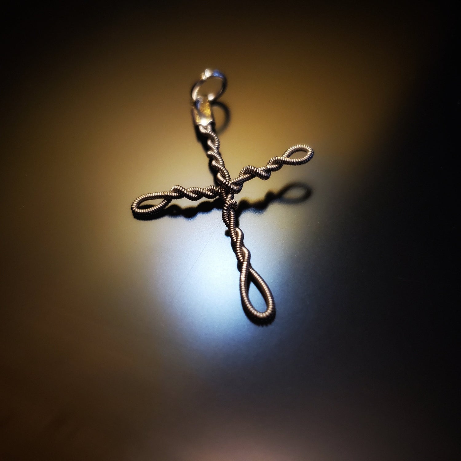 Upcycled guitar string cross style pendant 