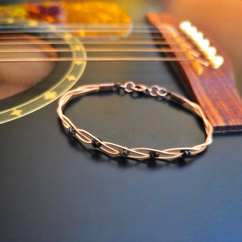 Braided Bronze Guitar String Black Ballend Unisex Bracelet on Black Guitar