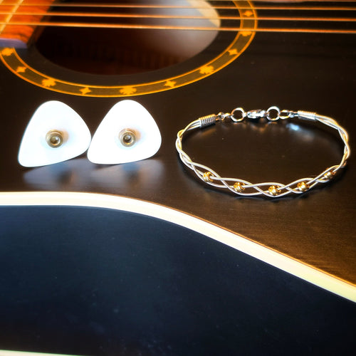 Braided Guitar String and Gold Coloured Ballend Clasp Style Bracelet and Guitar Pick and Ballend Earrings Jewelry Set on Black Guitar