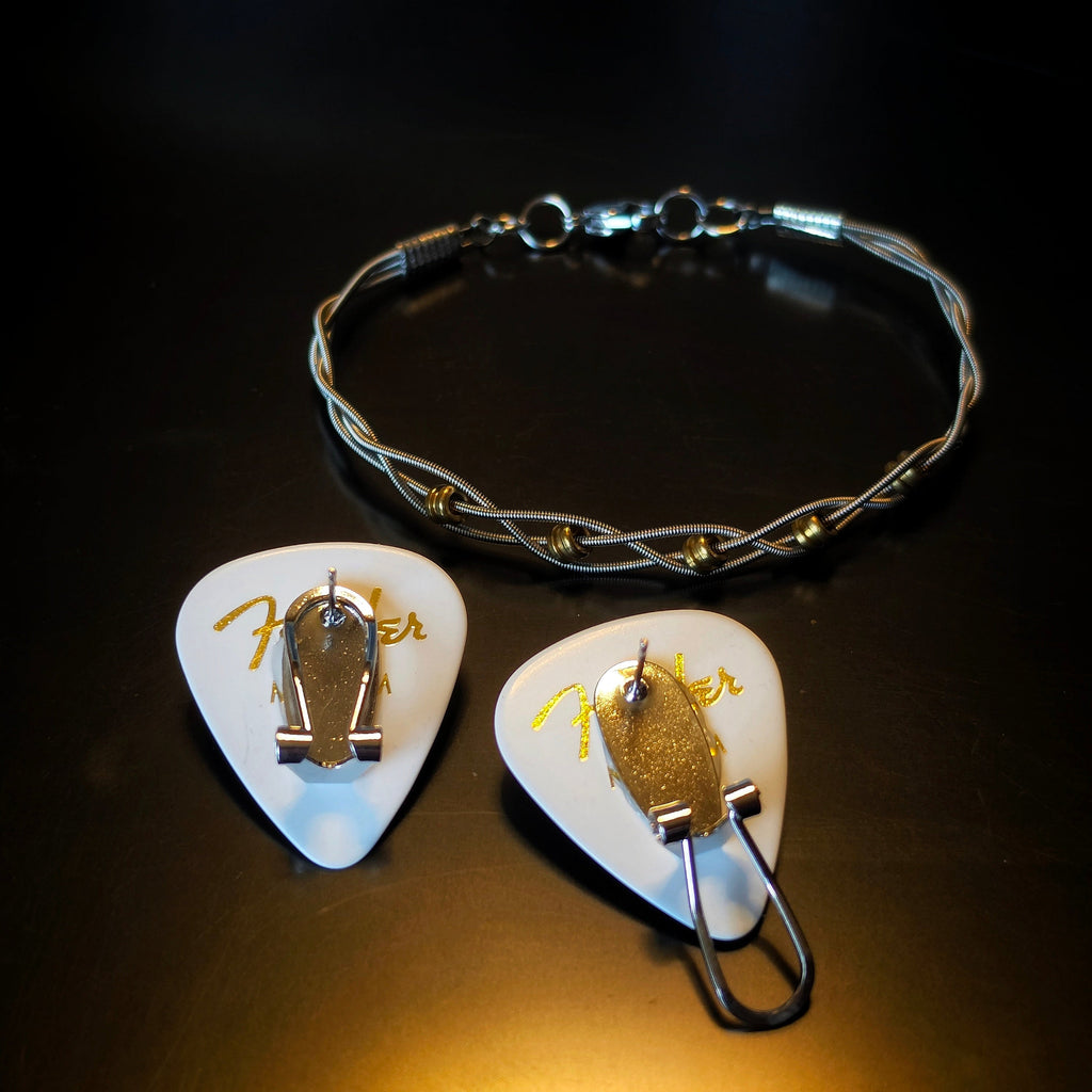 Braided Guitar String and Gold Coloured Ballend Clasp Style Bracelet and Guitar Pick and Ballend Earrings Jewelry Set on Dark Background - back view