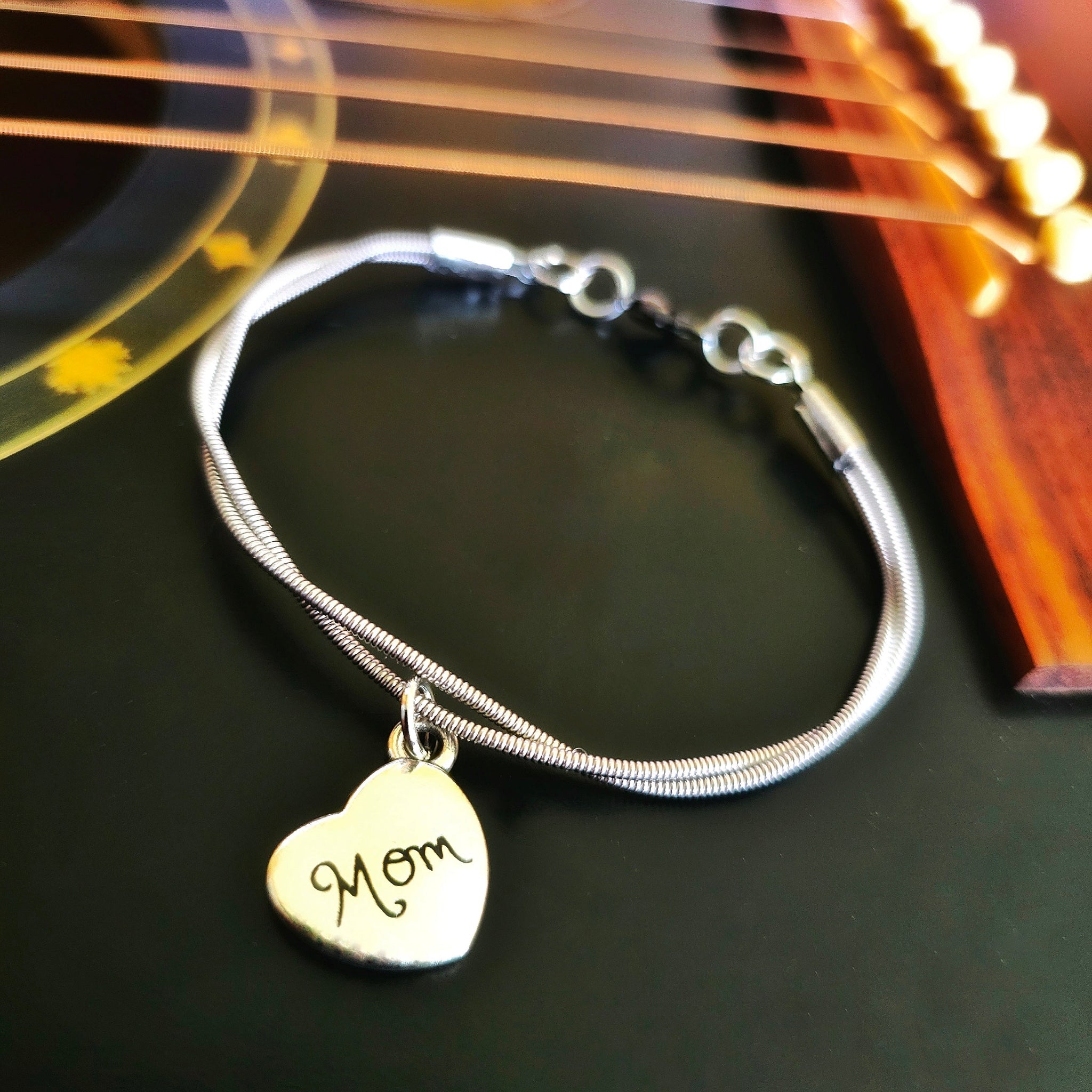 Guitar String Mom Charm Bracelet on Guitar