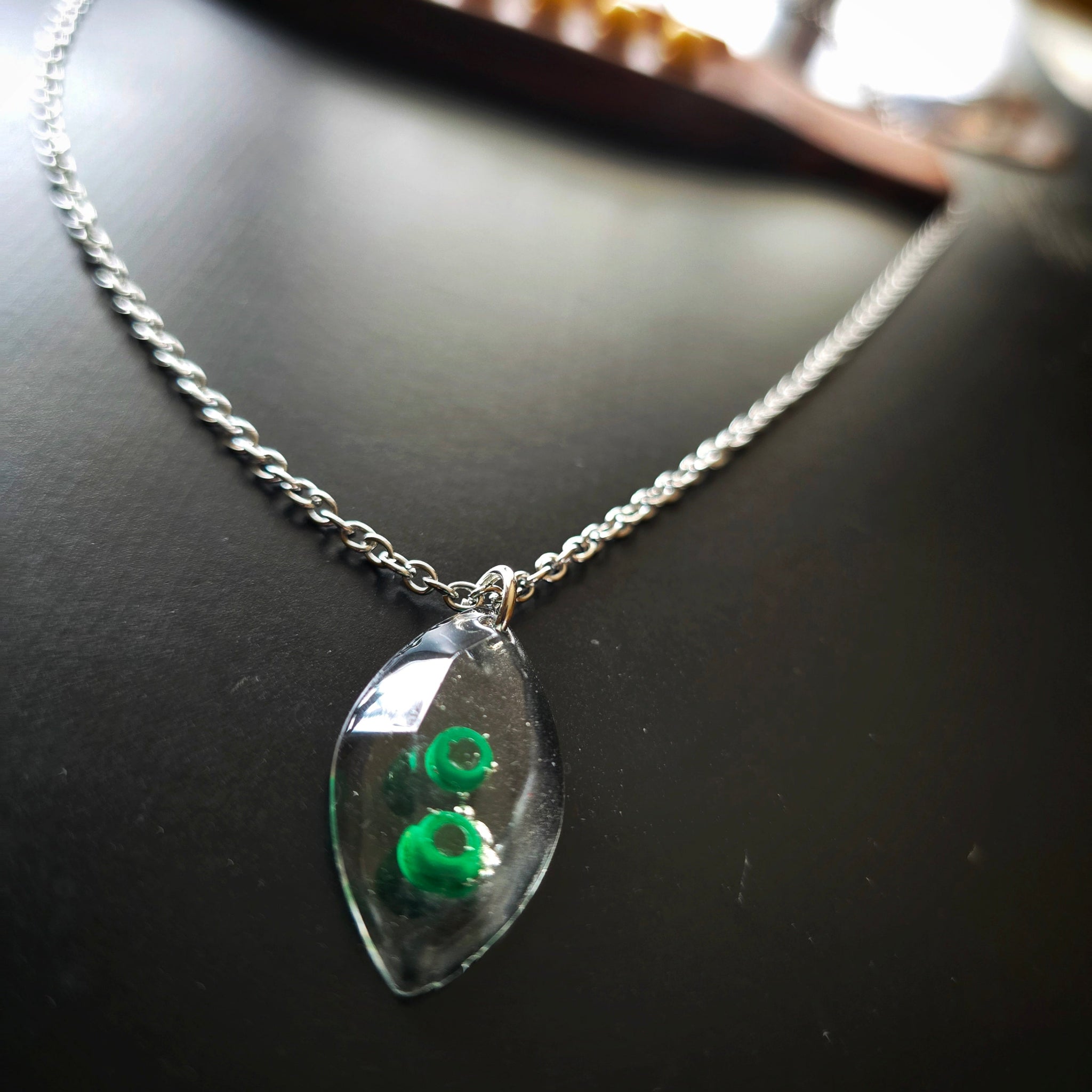 Marquise Shaped Resin Pendant with Green Guitar String Ballends
