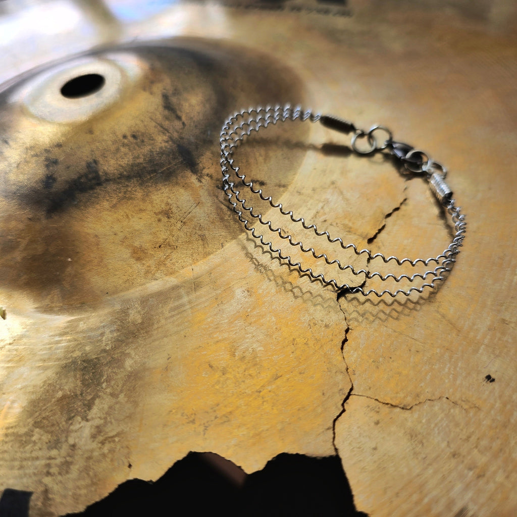 Upcycled 3 String Snare Drum Bracelet on Cymbal 