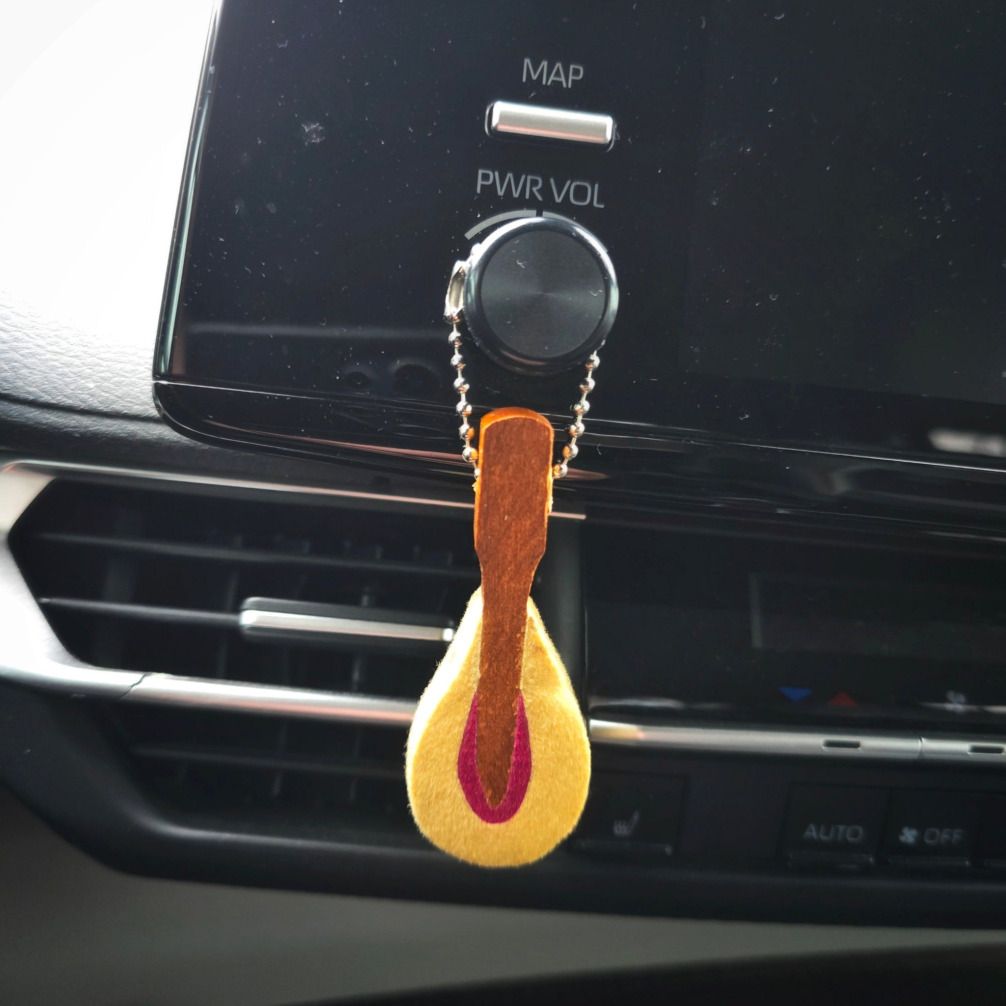 Upcycled Piano hammer essential oils diffuser on car radio button