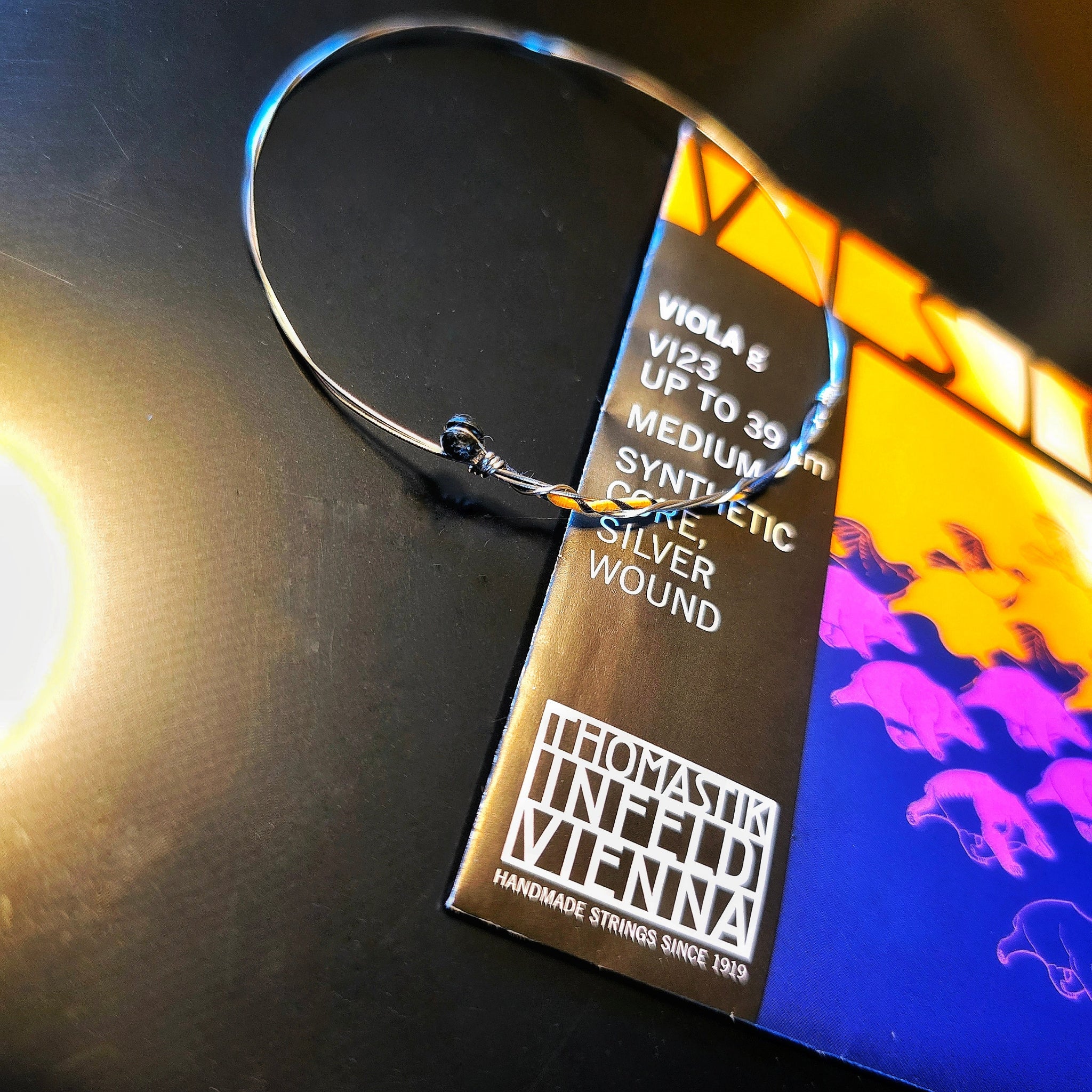 Viola String Bangle Bracelet on a Viola String Package (blue, pink and yellow)