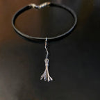Witch's Broom Guitar String and Black Leather Choker on Black Background