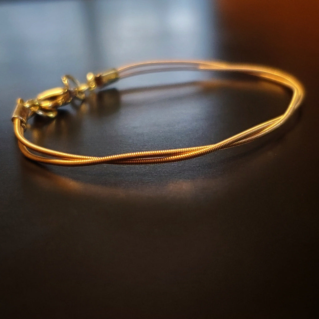 clasp style bracelet made from an upcycled mandolin string 