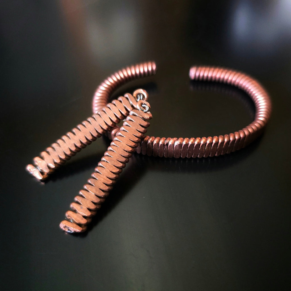 Upcycled Piano String Bracelets and Earrings Set on black background 