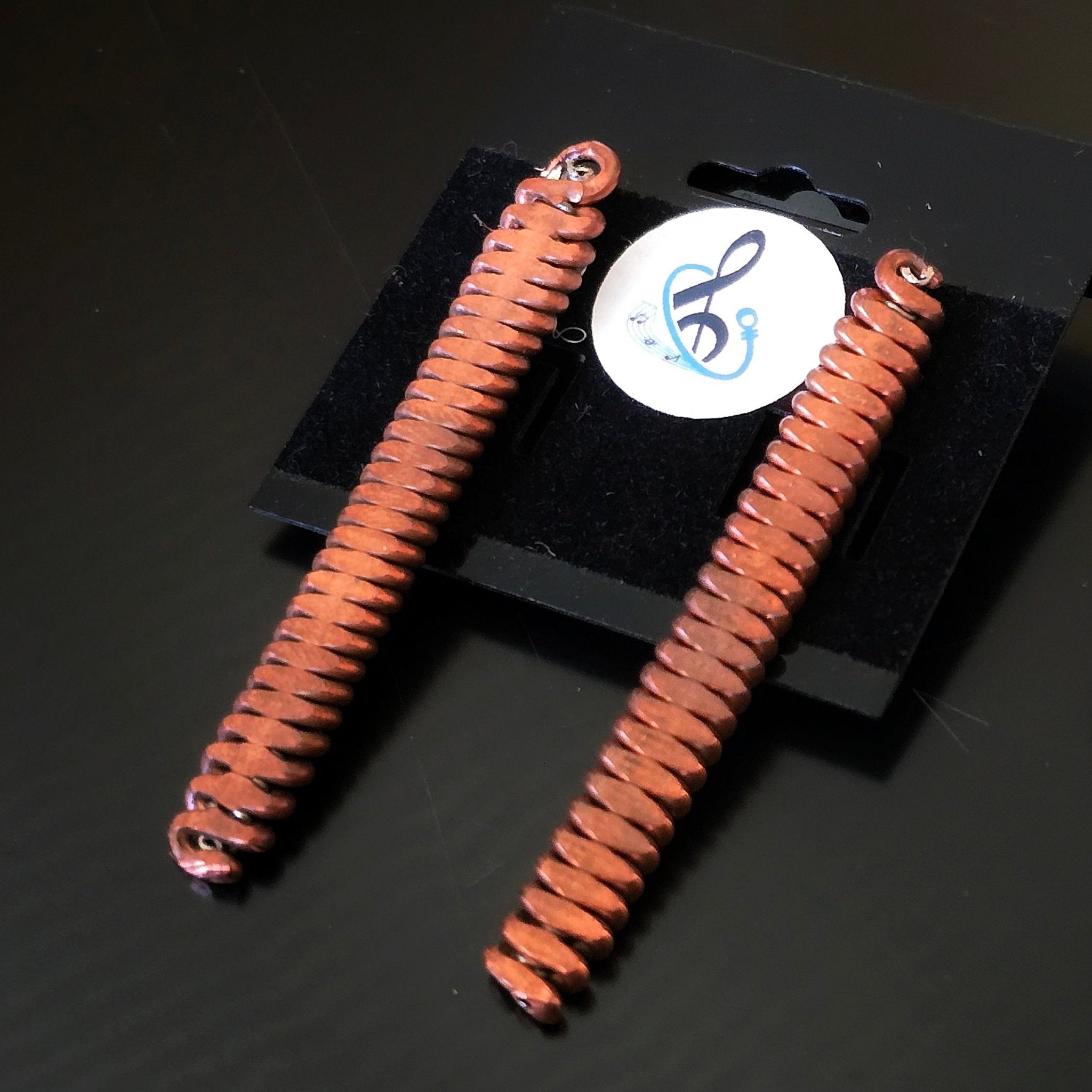 Upcycled Piano String Earrings black background 