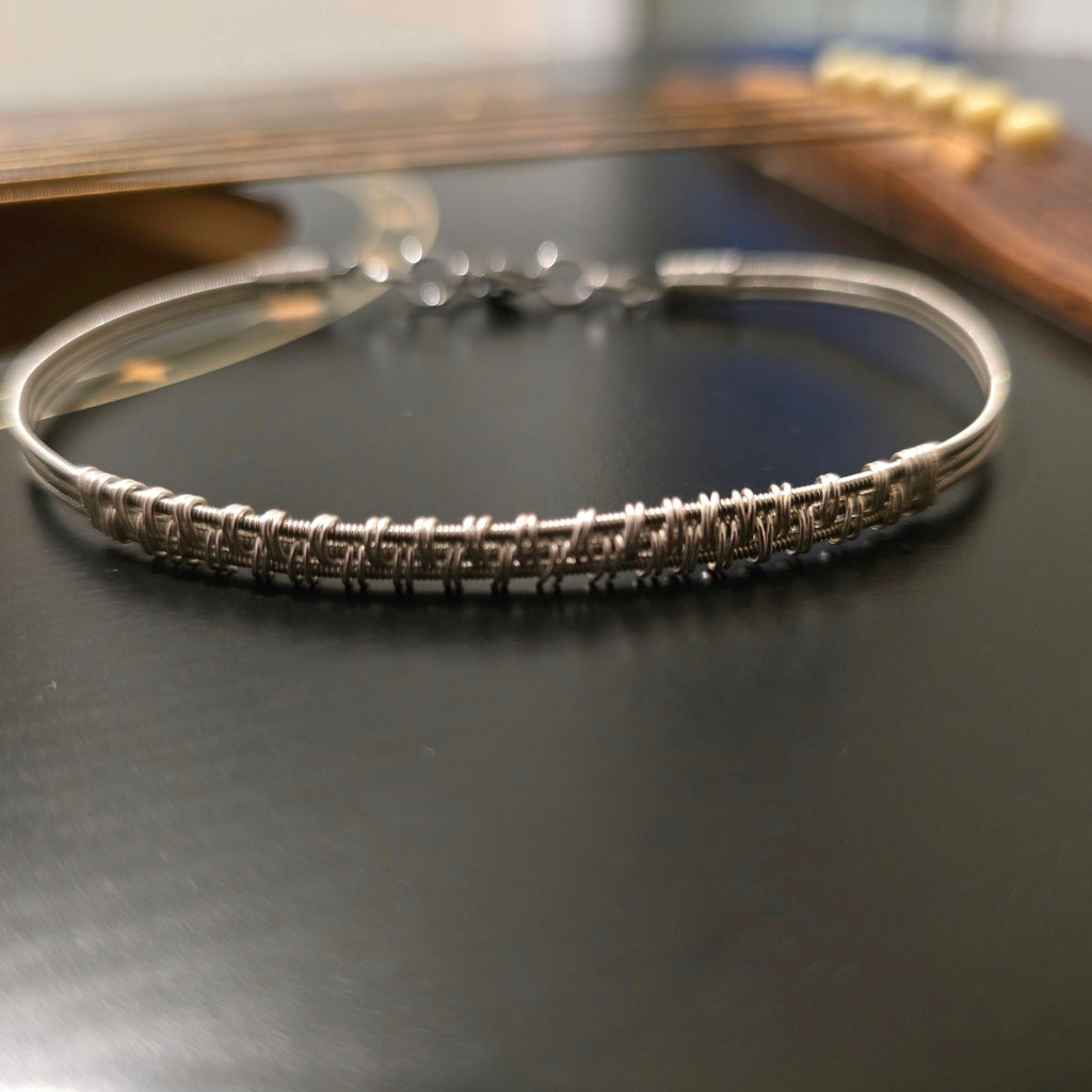 Bracelet unisexe tissé en corde de guitare