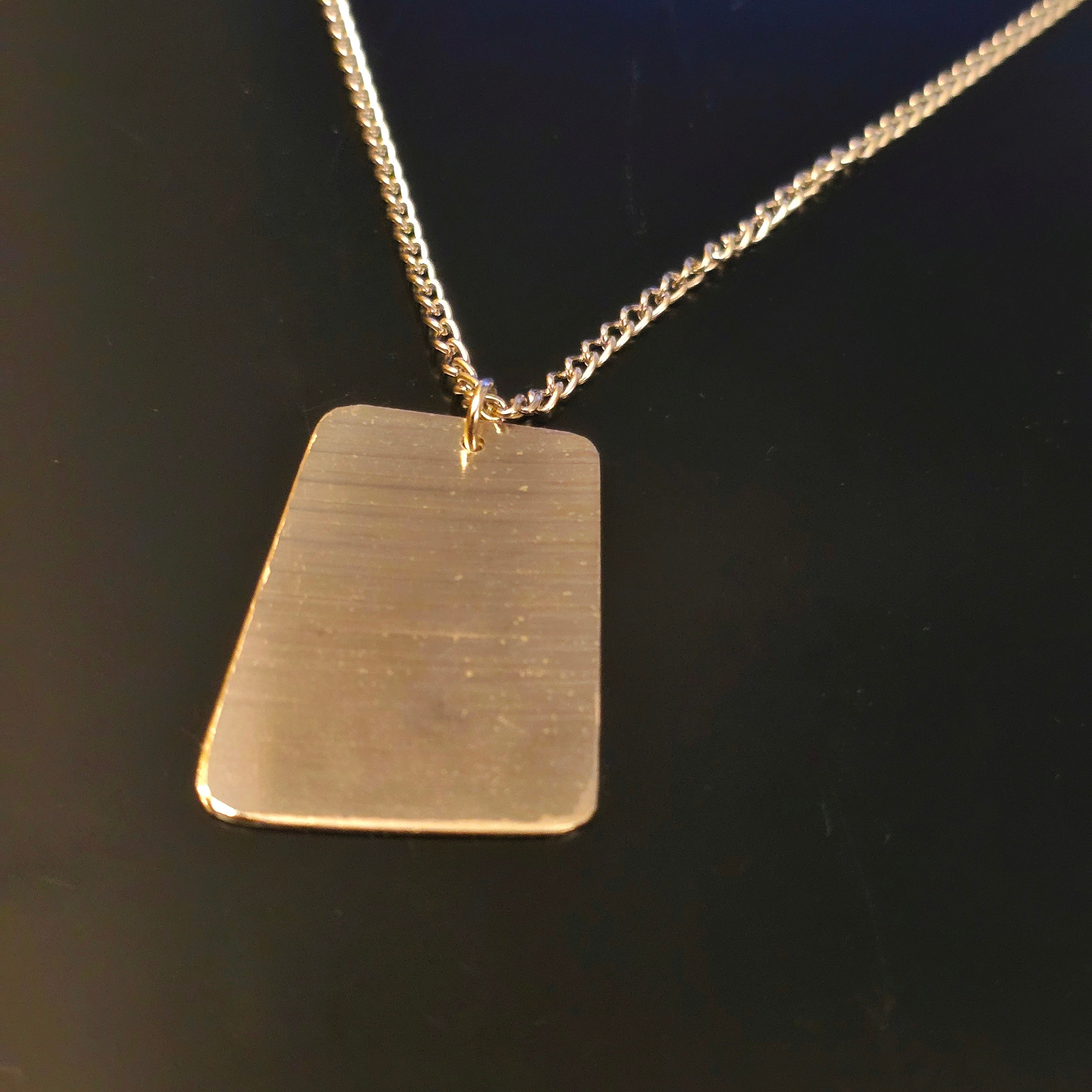 Collier unisexe de style « dog tag » en morceau de cymbale
