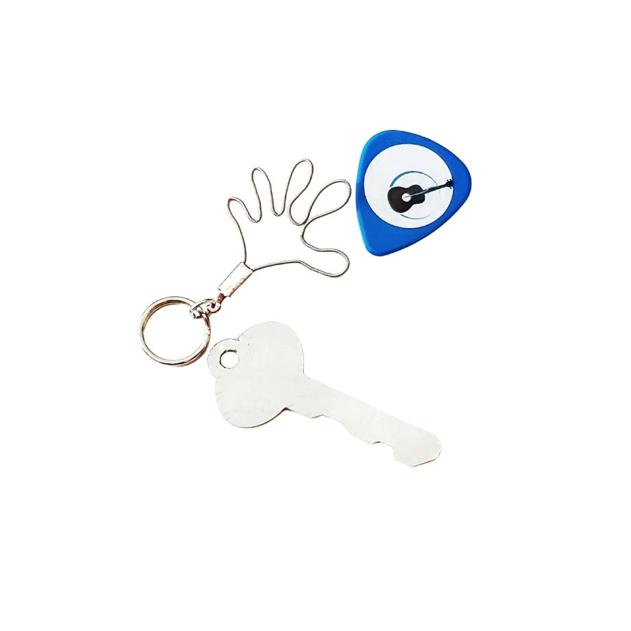 a keychain made from an upcycled guitar string shaped like a hand - above it is a blue guitar pick with an image of a black guitar - underneath is a silver key