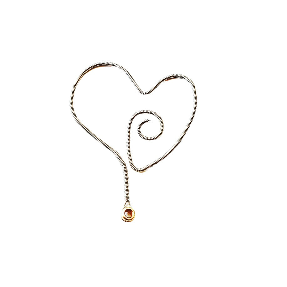 bookmark in the shape of a heart made from an upcycled guitar string - white background