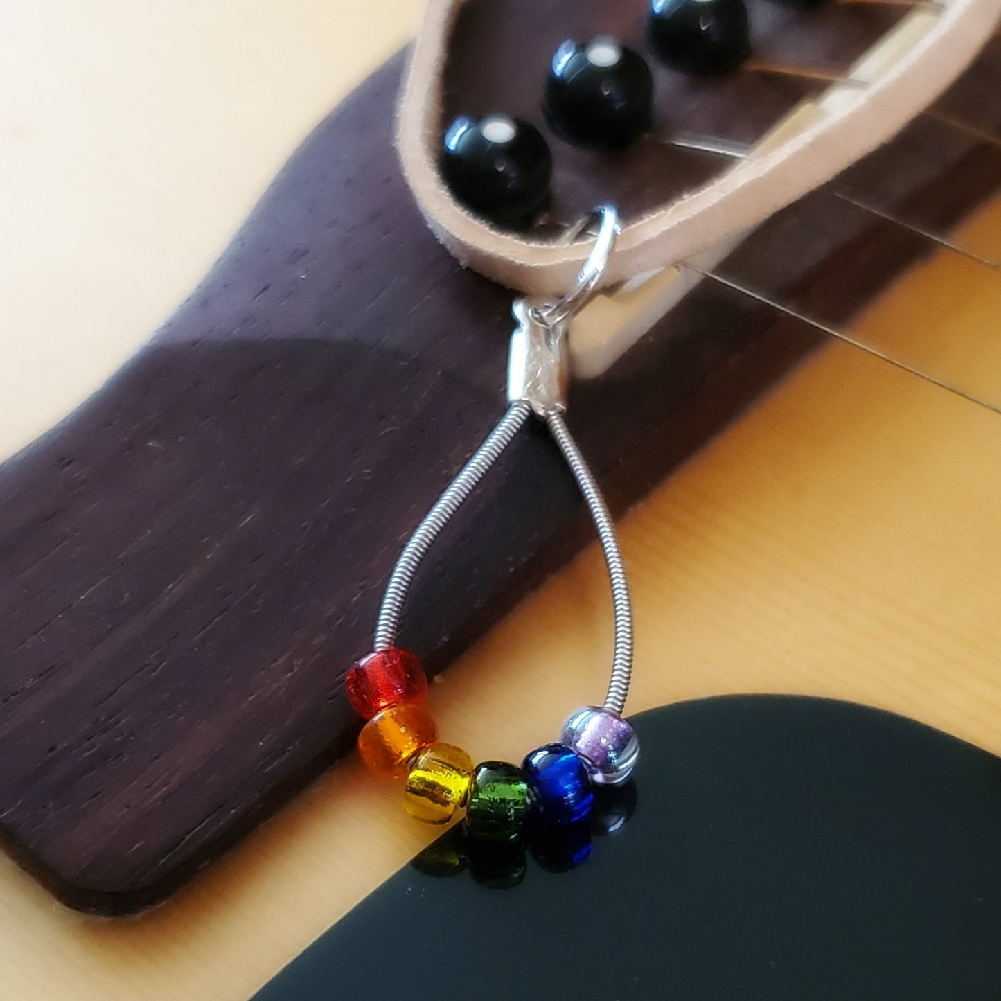 LGBTQ pride leather necklace with guitar string pendant
