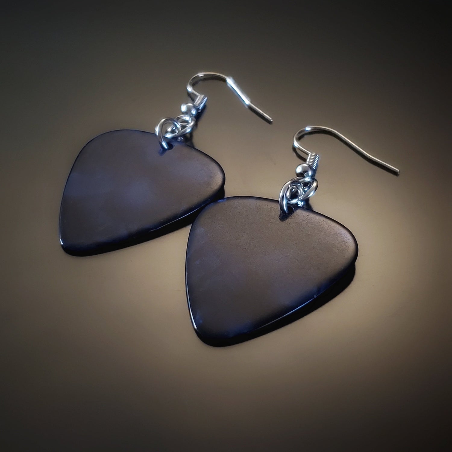 earrings made from blue guitar picks