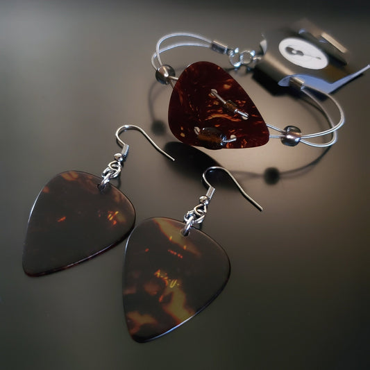 jewelry set The bracelet is made from both upcycled guitar strings and a beautiful turtle shell brown guitar pick. The earrings are made from matching plectrums (guitar picks)