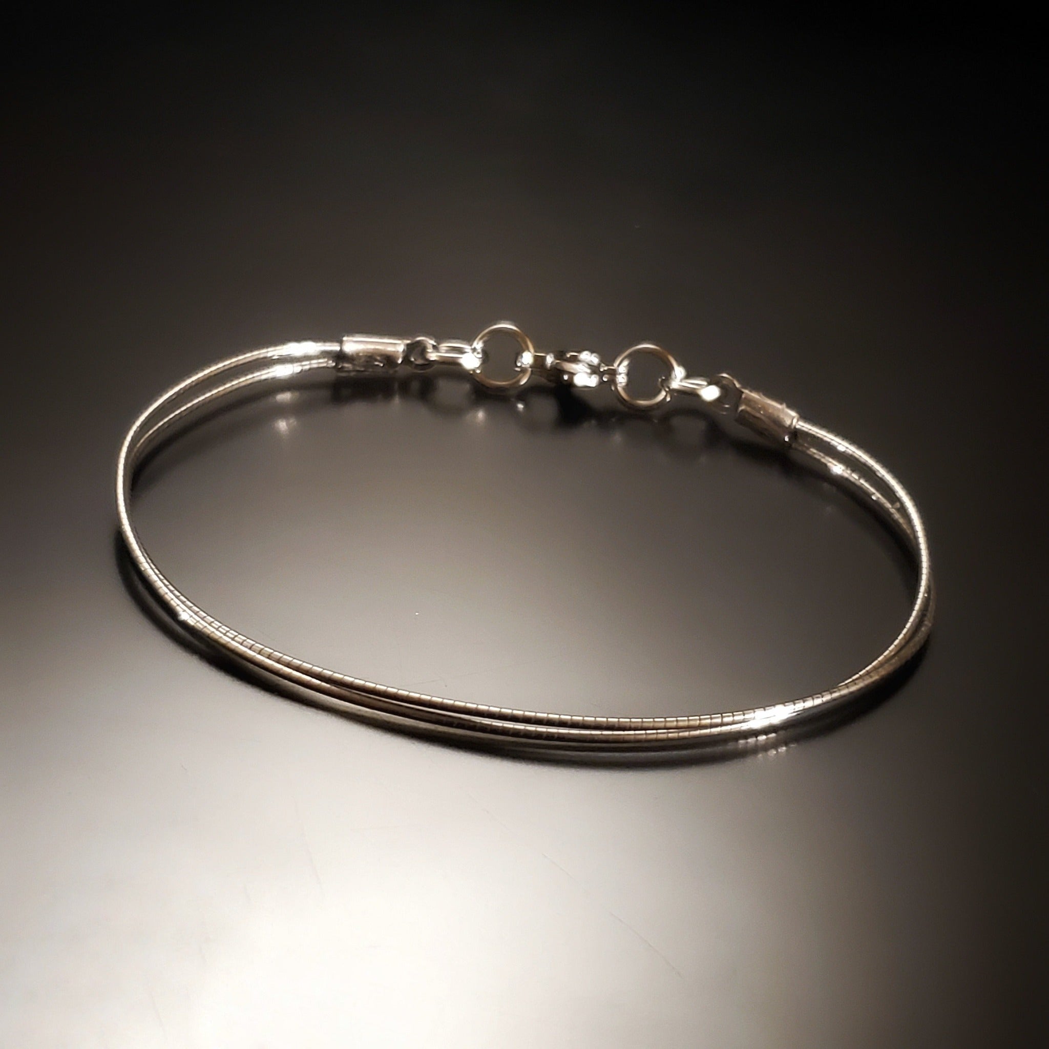Bracelet unisexe avec attache en corde de violoncelle