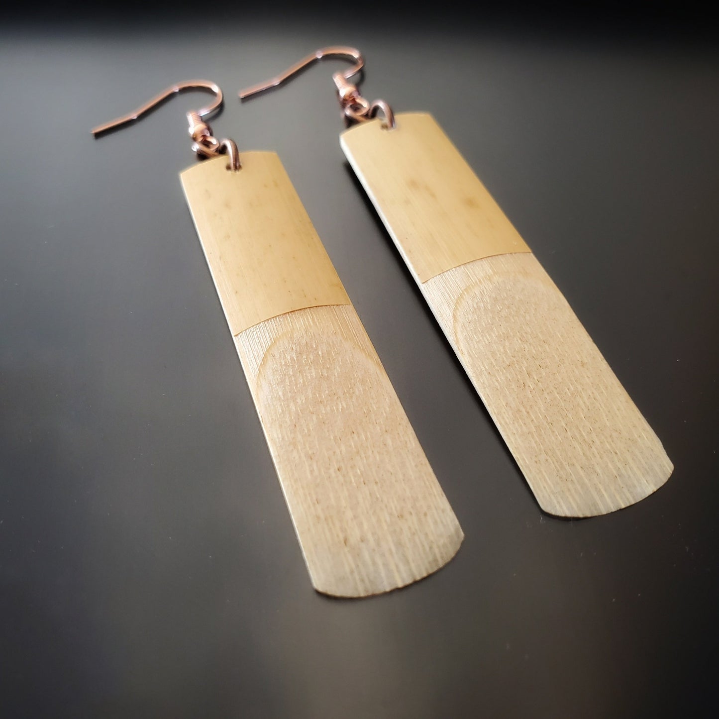 pair of earrings made from upcycled saxophone reeds