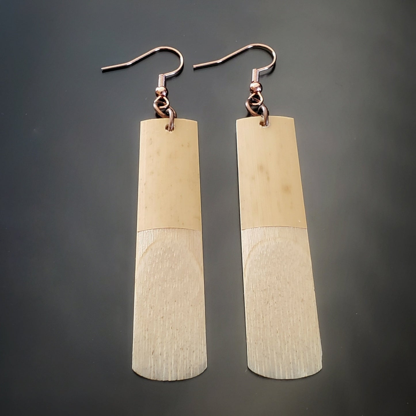 pair of earrings made from upcycled saxophone reeds