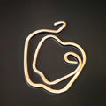 gold coloured guitar string bookmark teacher gift shaped like an apple on a black background