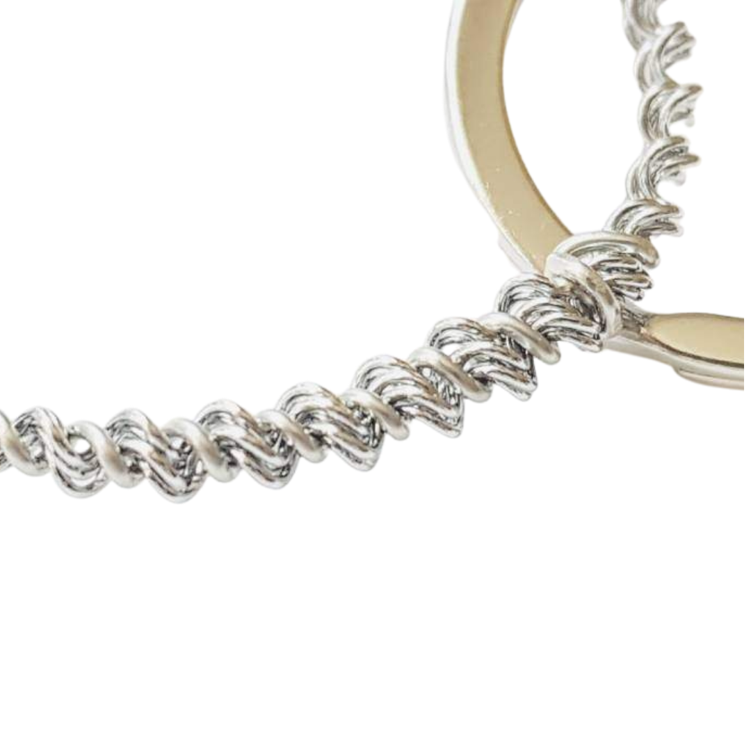 close-up of a keychain made from an upcycled snare drum string - white background