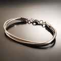 silver coloured clasp style bracelet made from upcycled upright bass strings