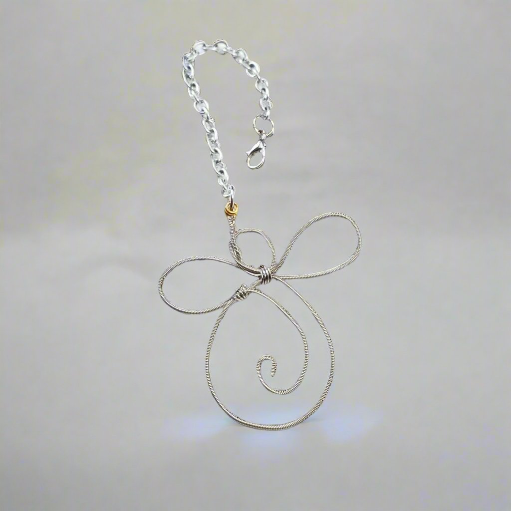 rearview mirror decoration shaped like an angel made from an upcycled guitar string