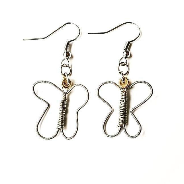 a pair of earrings made from upcycled guitar strings shaped into butterflies -  white background